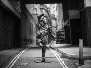 Hasselblad 907X & CFV 100C sample image – mono street portrait of girl posing full length in an urban environment