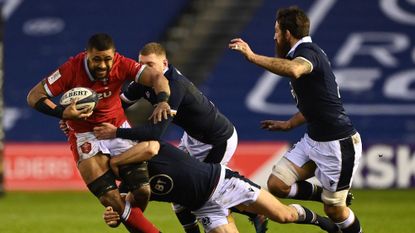 Taulupe Faletau of Wales is tackled during the Guinness Six Nations match between Scotland and Wales at Murrayfield