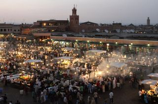 Marrakech, MOROCCO:A general view taken late 27 June 2006 shows the Jemaa el fna square in Marrakech, which attracts many tourists as well as poor children who sell themselves to pedophiles f