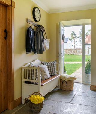 kinross shire farm hallway with yellow wall and glass door