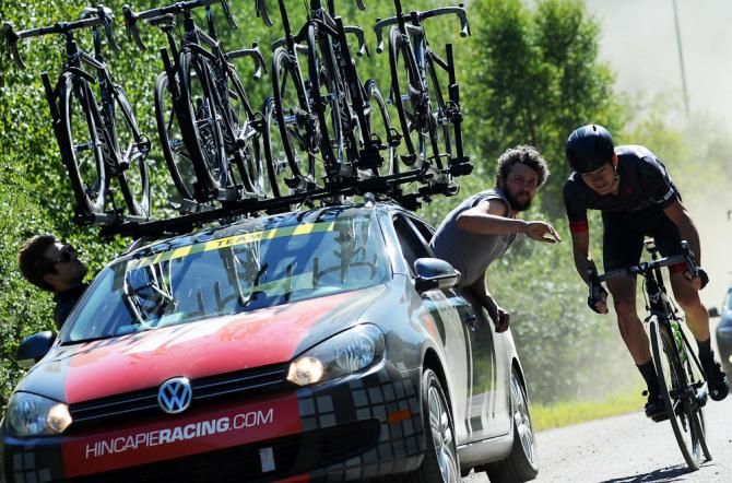 A Hincapie rider gets service from the team car.