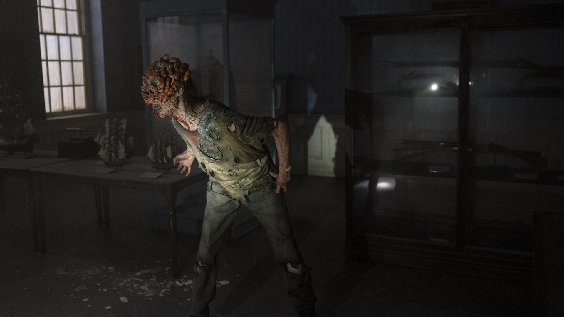 A clicker scans the room for any human hosts in The Last of Us TV show