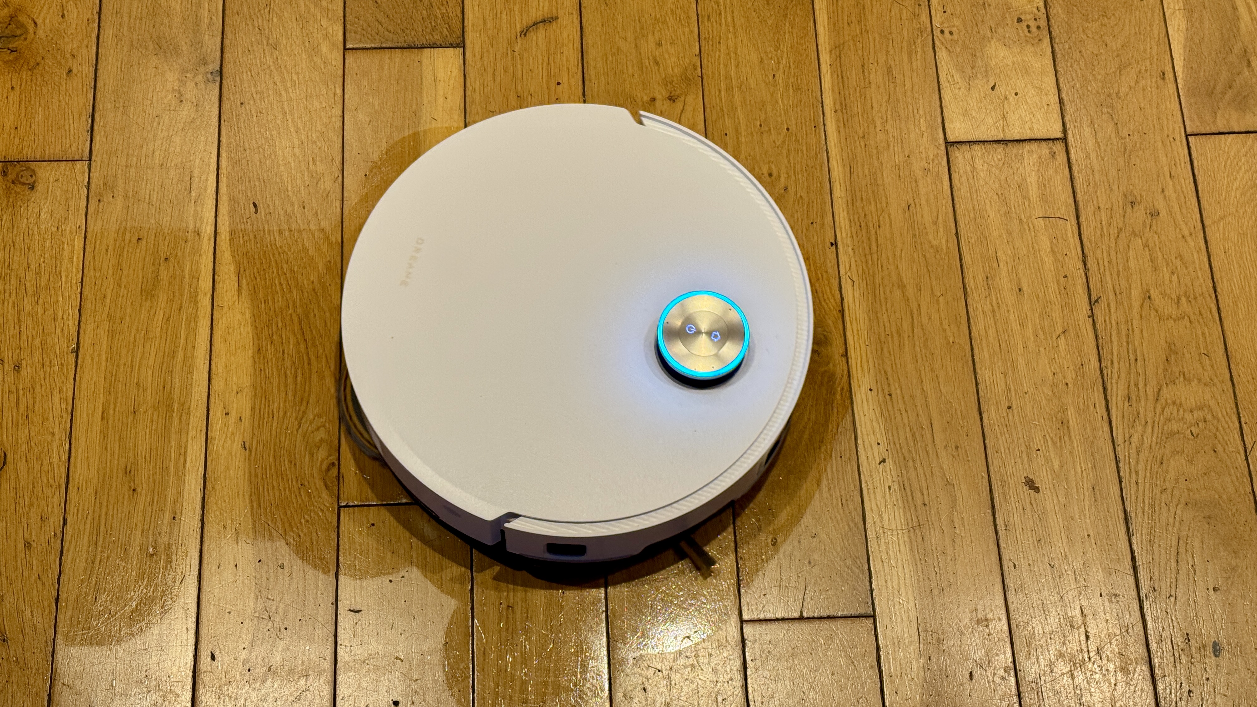 Dreame Matrix10 Ultra robot vacuum mopping a wooden floor