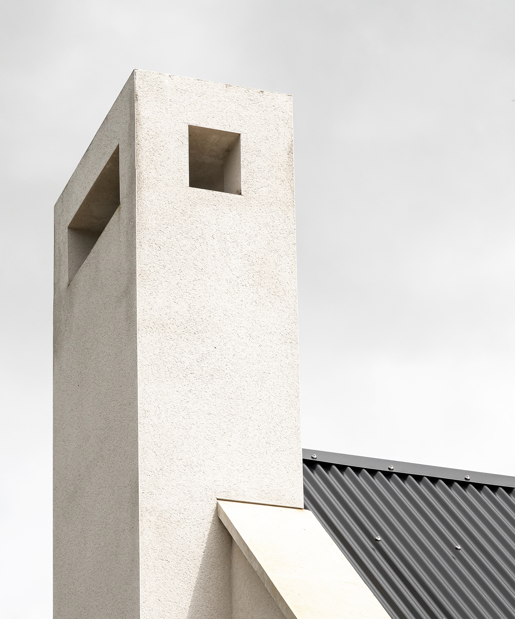 A contemporary concrete chimney on a new self build home