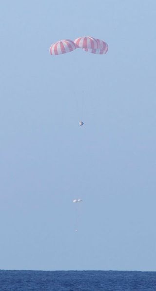 Dragon Spacecraft with Main Parachutes Deployed