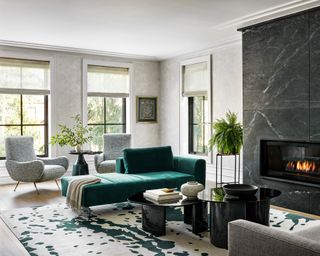 modern living room with velvet forest green sofa