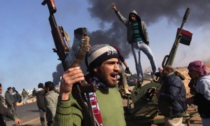 Libyan opposition forces retreat eastward after troops loyal to Moammar Gadhafi press a counter-offensive: Retired Gen. Wesley K. Clark recommends the U.S. stay out of Libya's civil war.