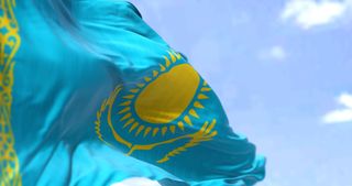 The flag of Kazakhstan waving in the wind