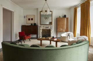 A living room designed with a central coffee table