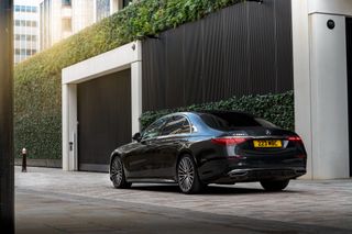 Black Mercedes S-Class on road