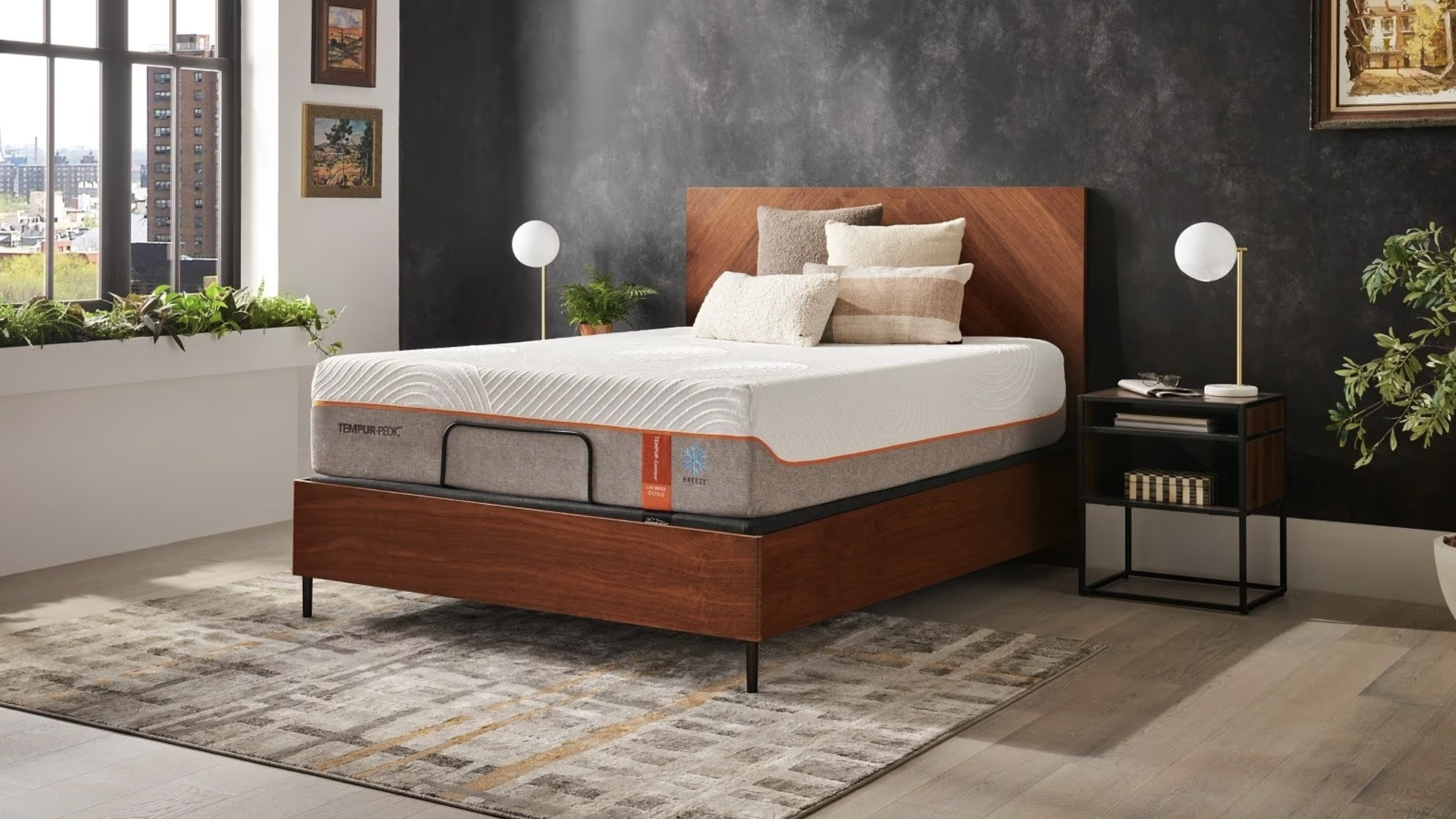 Tempur-Pedic Tempur-Contour Luxe Breeze mattress in an urban bedroom with a brown wood bed base with headboard