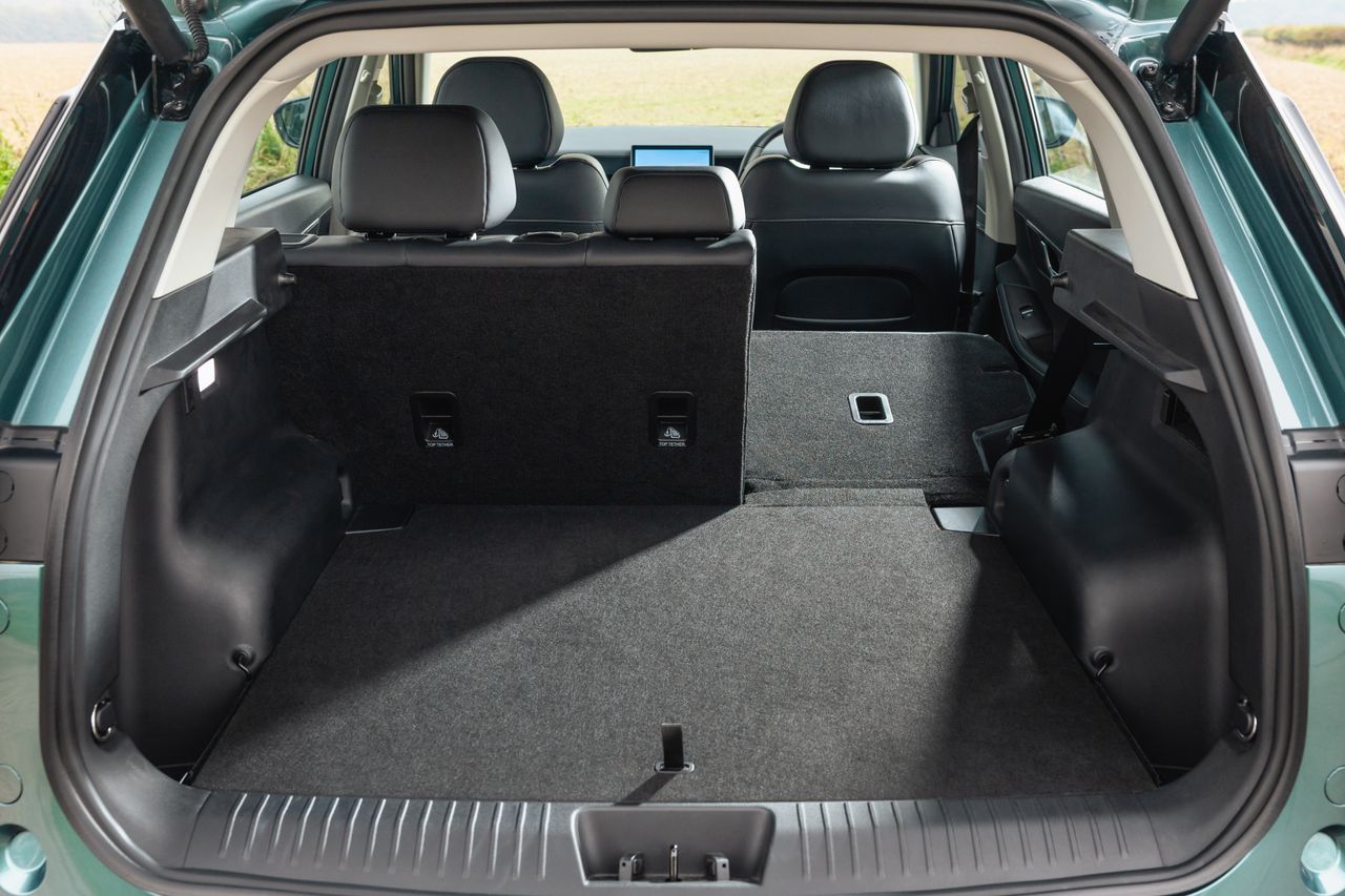 Interior shots of the Jaecoo 5, showing the boot, seats, screen and driving position