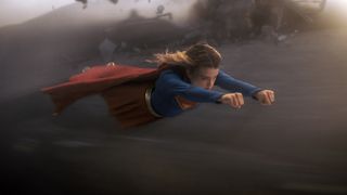 Supergirl flying through the air