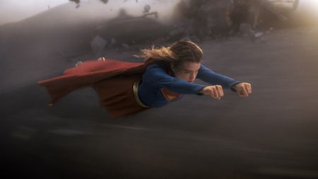 Supergirl flying through the air