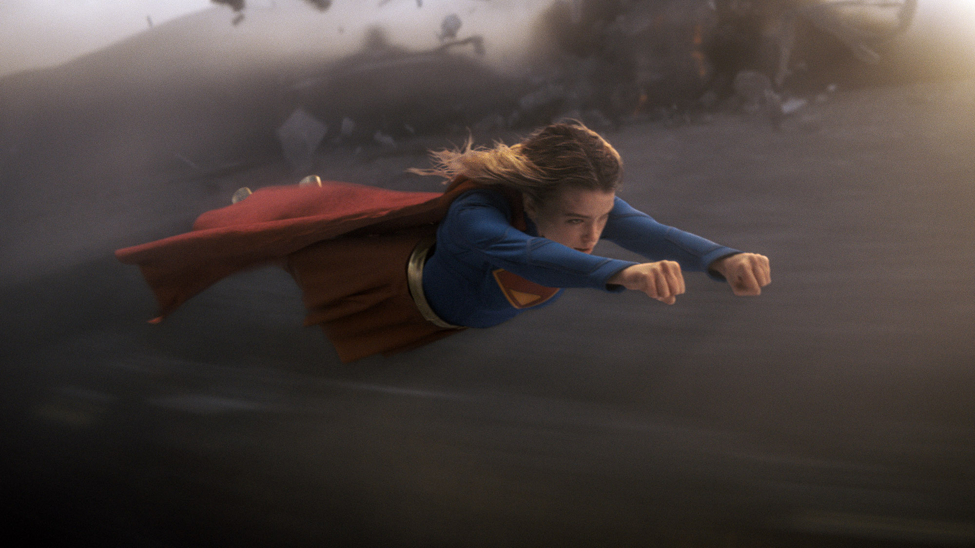 Supergirl flying through the air