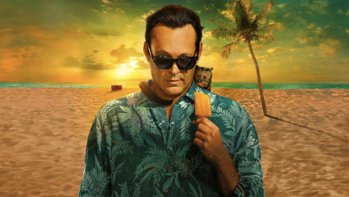 Vince Vaughn posing with a monkey on his shoulder while he eats a popsicle