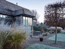 The terrace and the 15th century barn © Jason Ingram