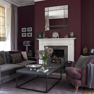 living room with fireplace sofa set and burgundy walls