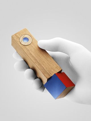 'Twistymote' a wood wand with a four-colour turning base that customises function