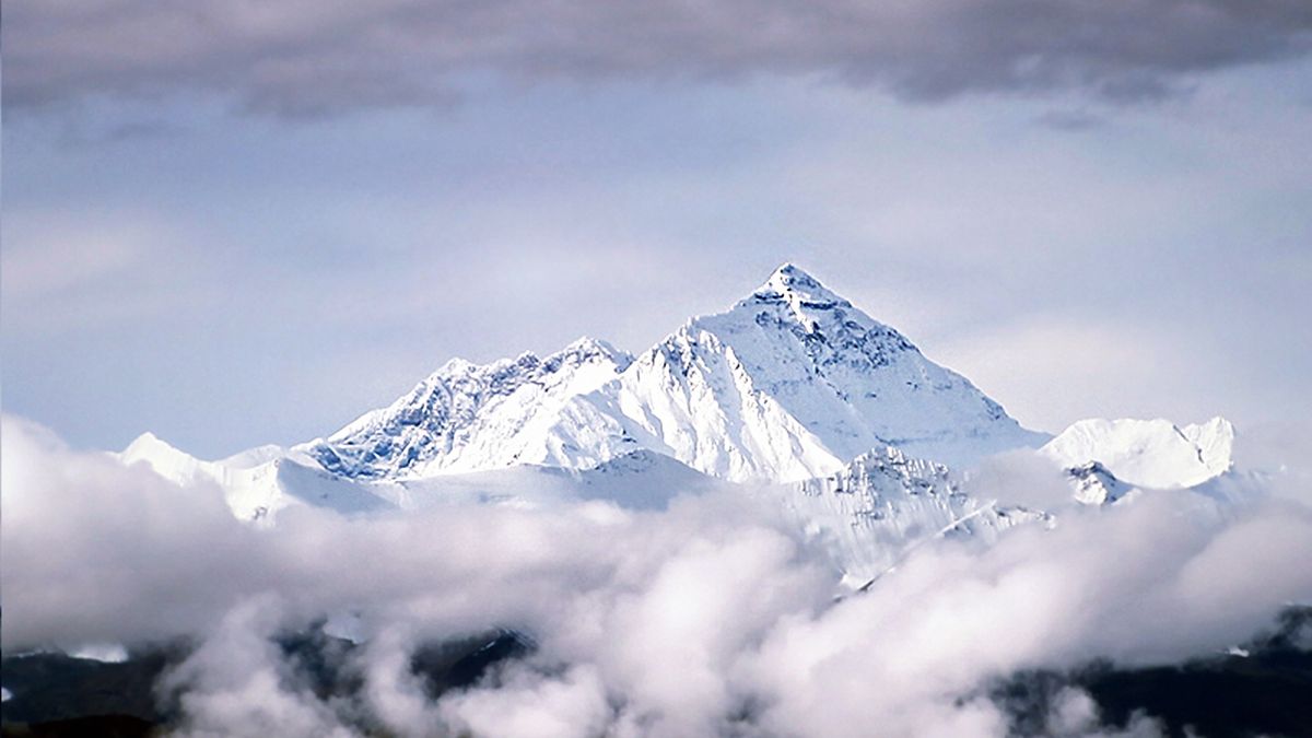 Mount Everest rises out of the clouds