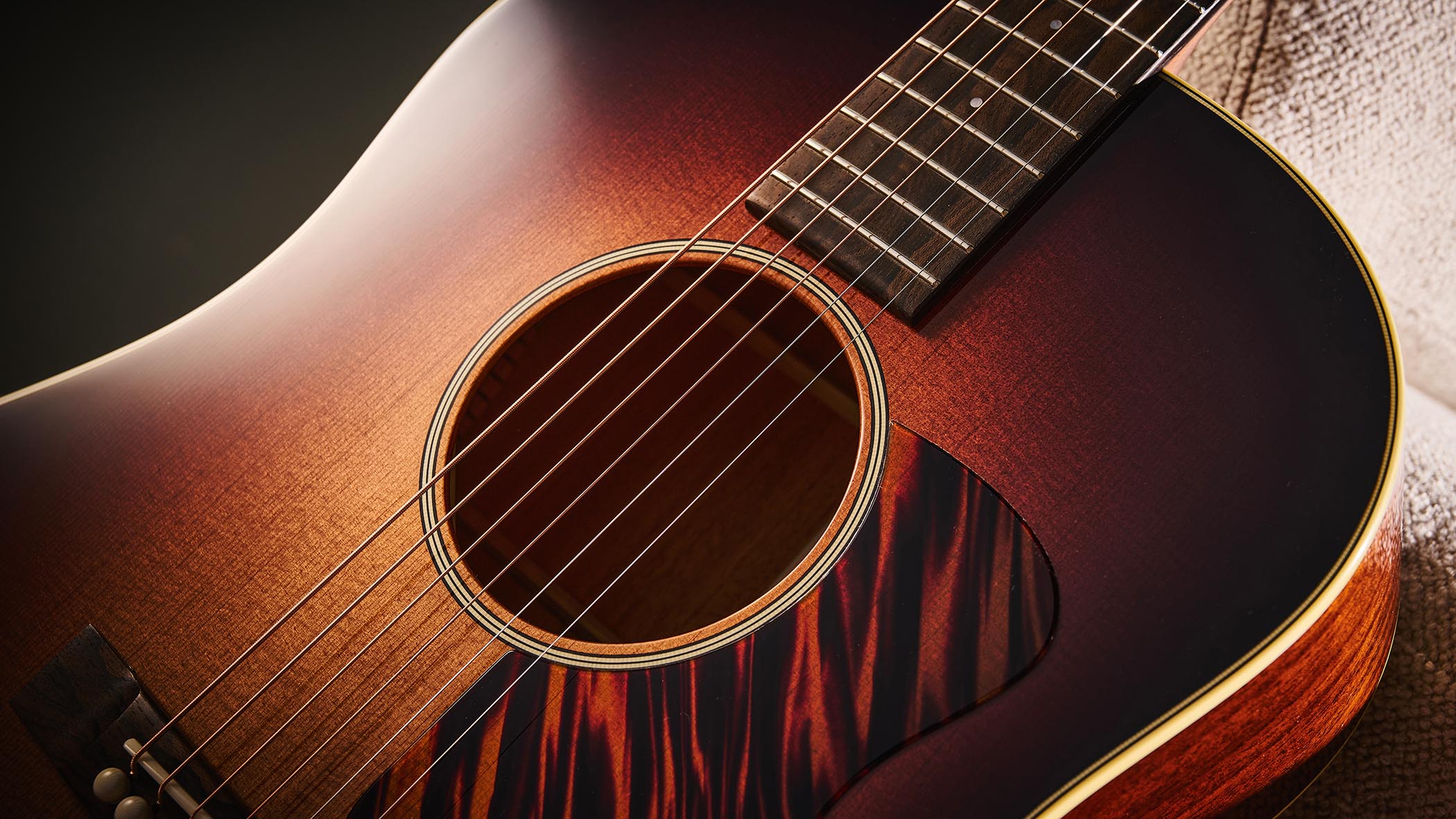Bourgeois Slope D Standard T/S: Inspired by the J-45, this Touchstone series acoustic has. a beautiful high-gloss finish with a tiger-stripe pickguard