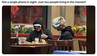 Apple Vision Pro worn by two people at a restaurant