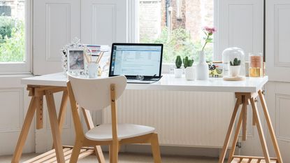 home office with transparent desk and laptop