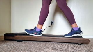 Our reviewer testing the Urevo SpaceWalk E4W treadmill