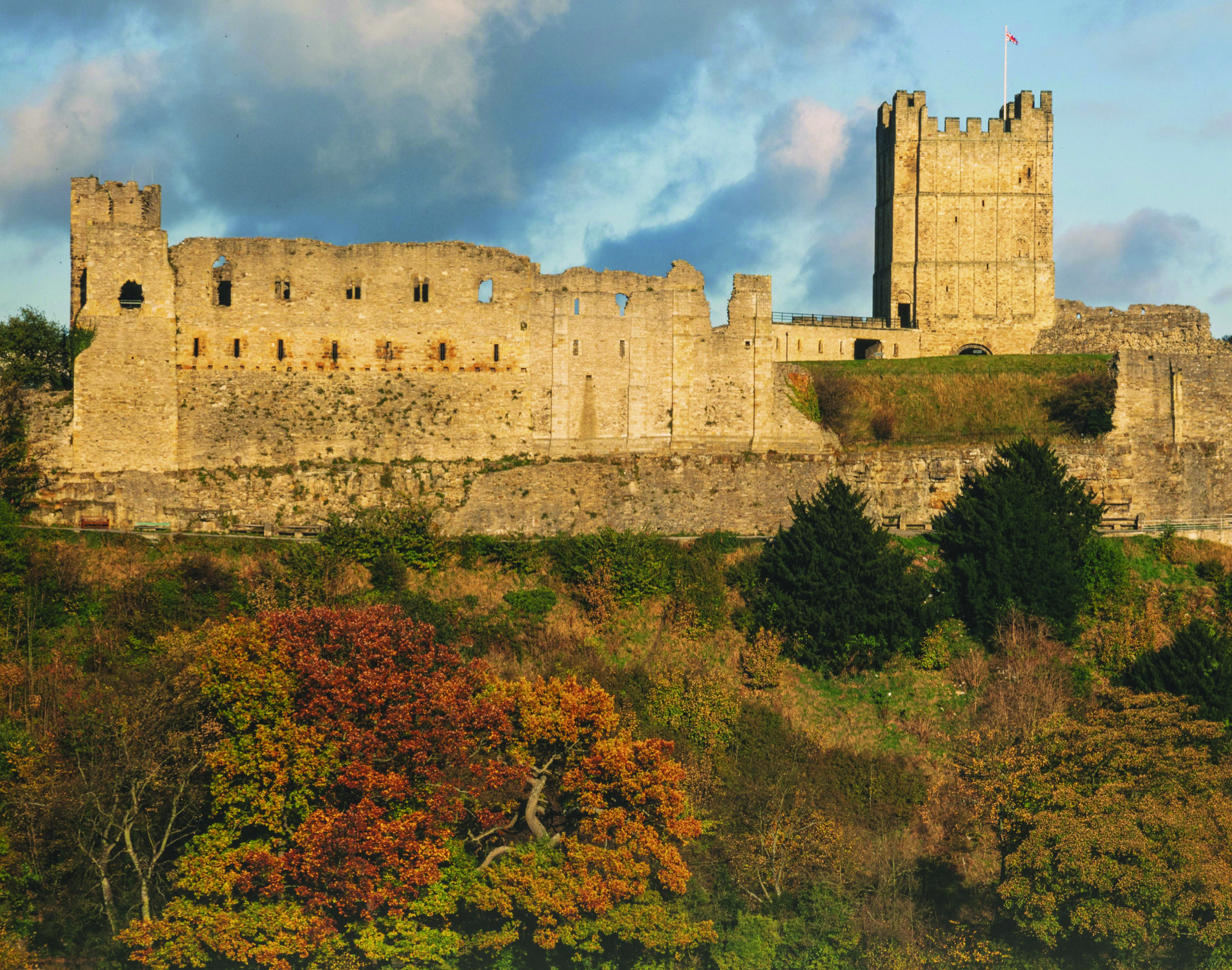Richmond Castle on the top of the hill in the evening light