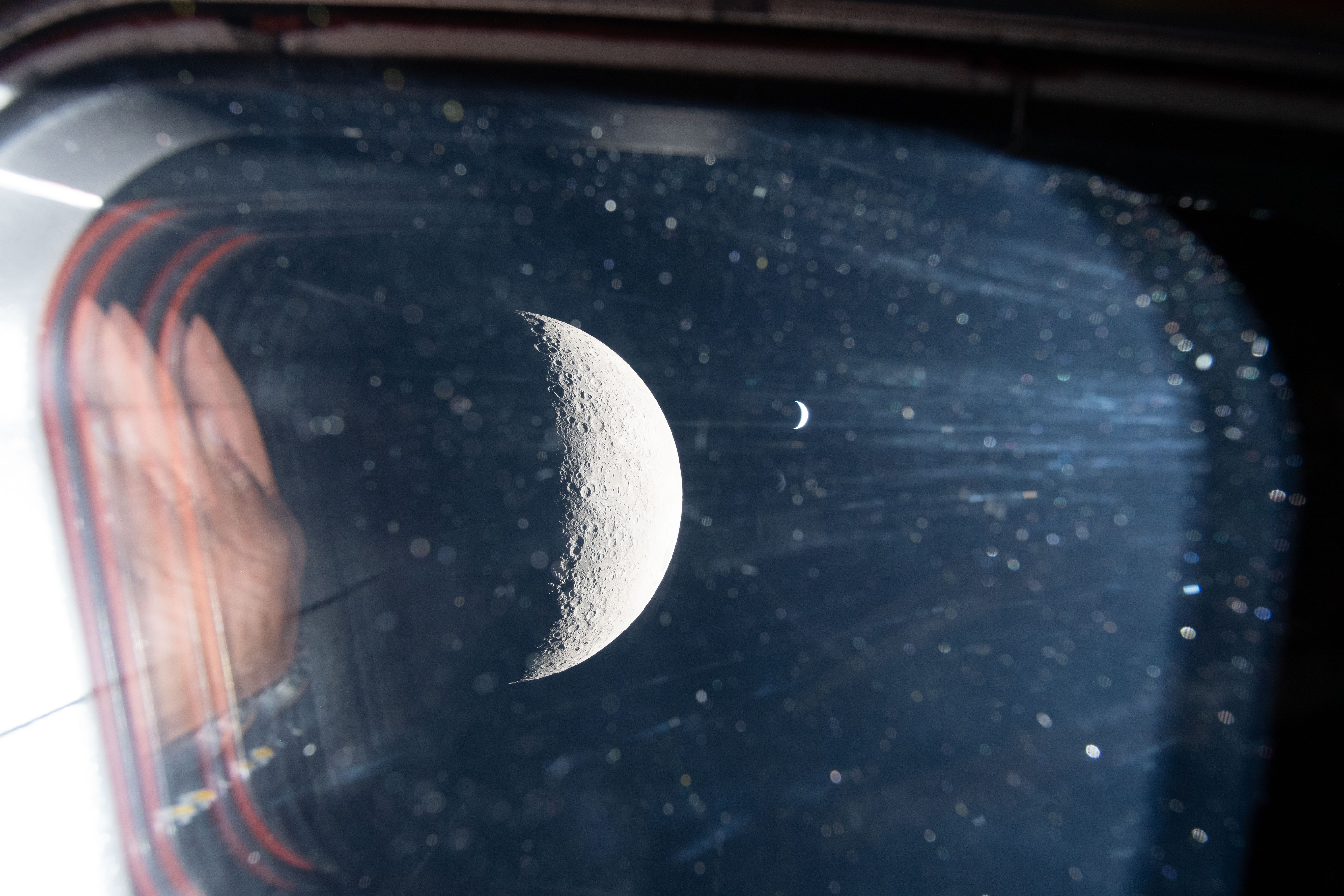 The Earth and moon seen out of the Artemis II capsule