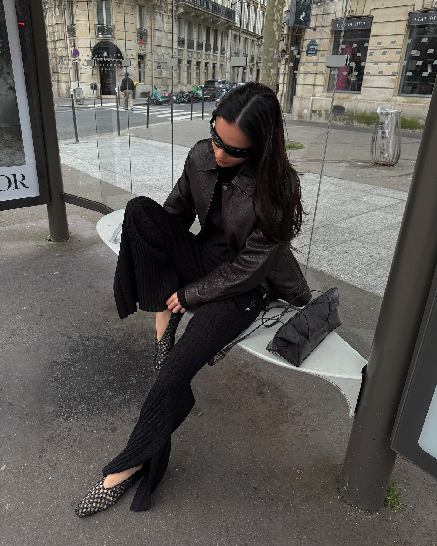 An influencer wearing a pair of almond-toe shoes.