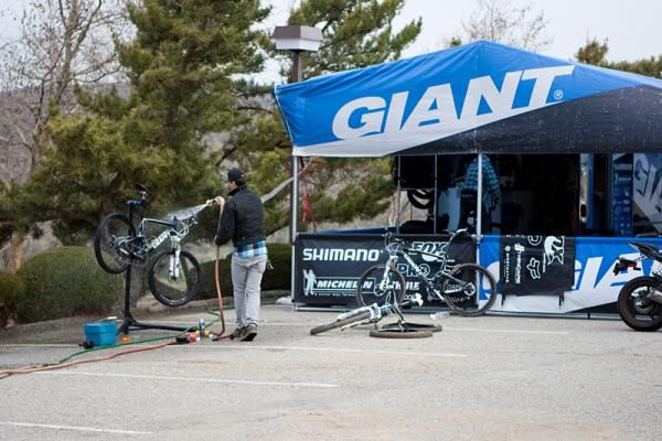 Team mechanic Justin Morse cleans one of his rider's bikes.