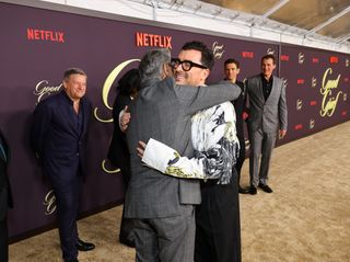 Eugene Levy and Dan Levy embrace during the premiere of 'Good Grief.'