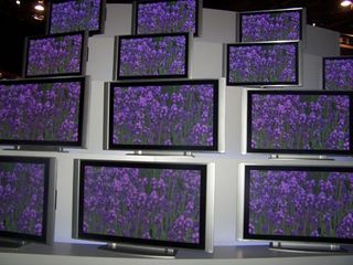 At the edge of Hitachi's booth is a giant wall of its plasma HDTVs.