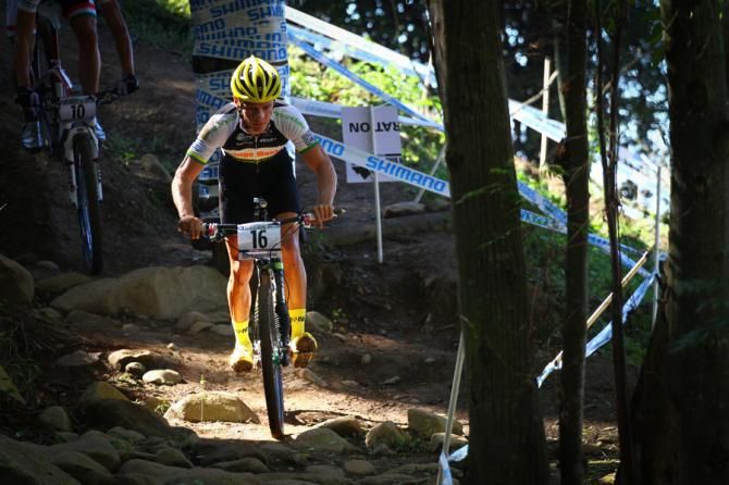 An Orange Monkey-Cannondale rider racing at the World Cup