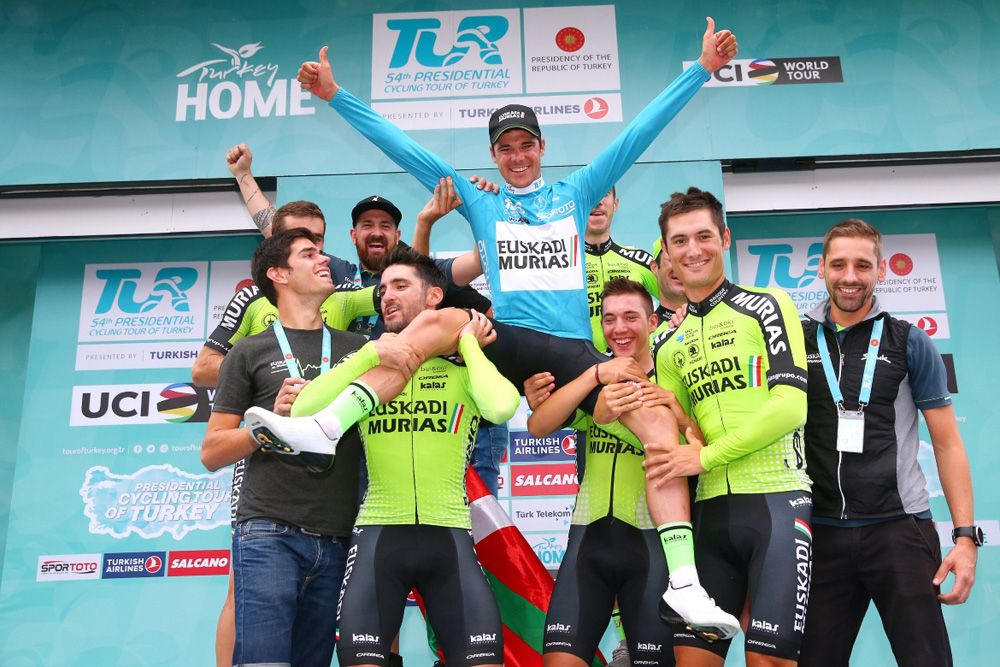 Eduard Prades is lifted in the air by his Euskadi-Murias teammates