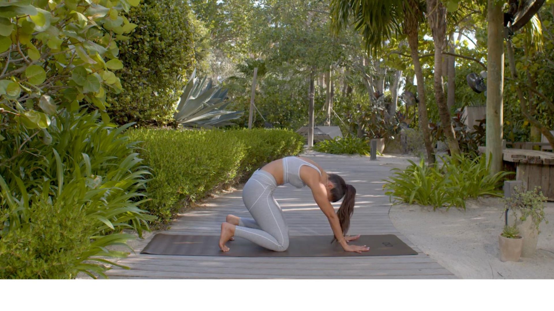 woman does yoga outdoors