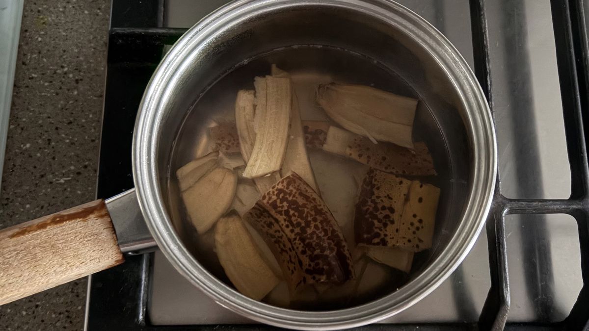 A close up of banana peels in boiling water