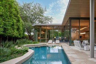 Outdoor pool at a modernist house by smitharc