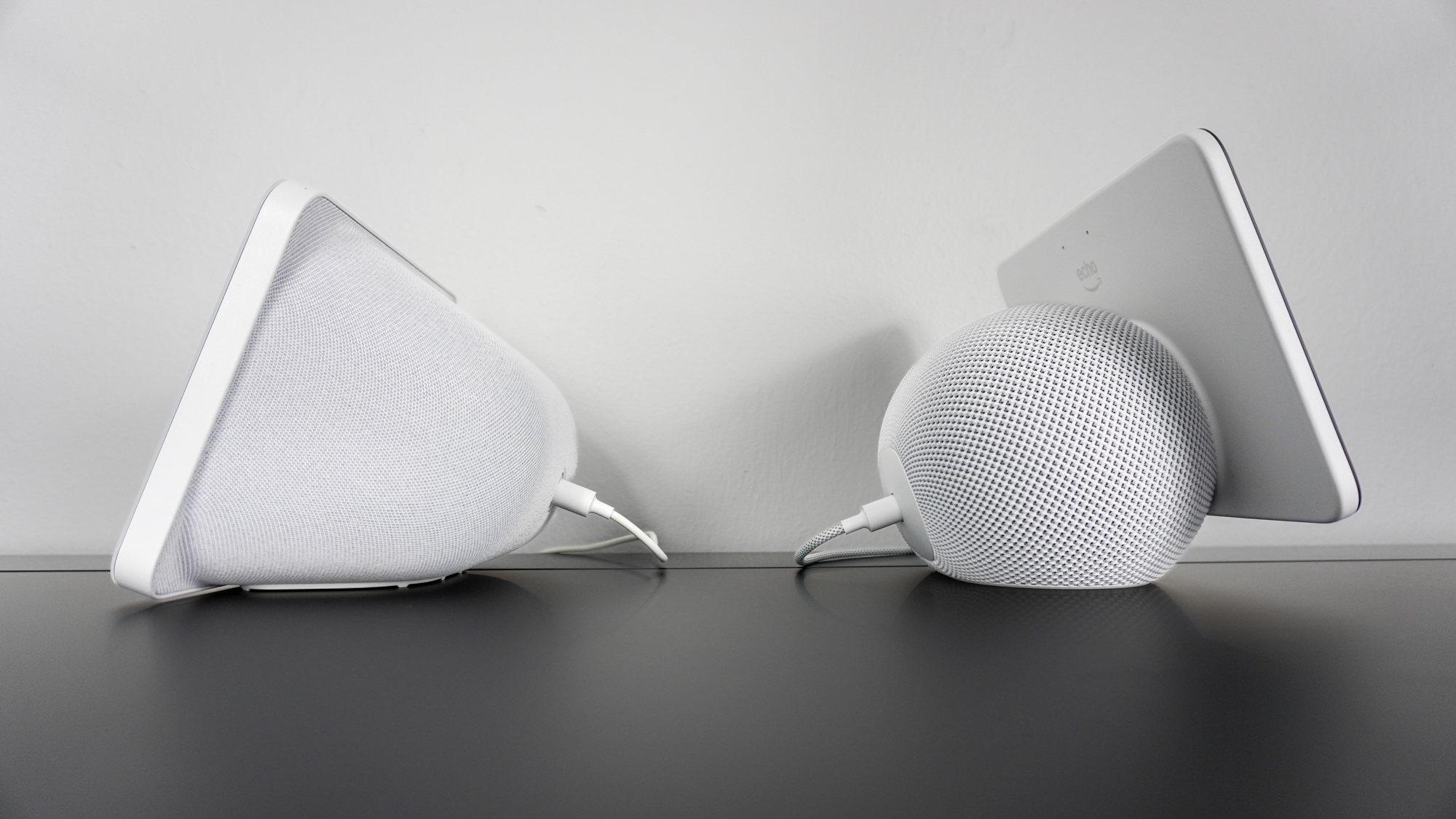 The Echo Show 8 (3rd Gen) on the left and the Echo Show 8 (4th Gen) on the right, side by side on a desk