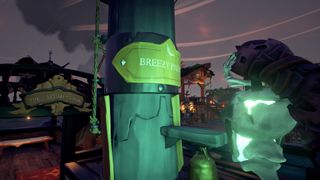 A screenshot from Sea of Thieves showing a mast with a plaque on it that says "Breezy Palms" and a ship name crest behind it that says "The Warmaker's Woe"
