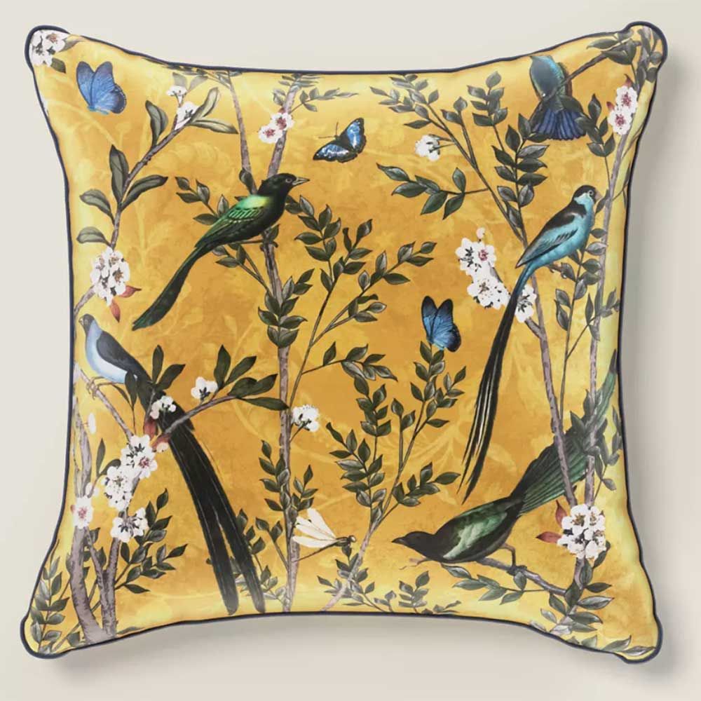 ochre velvet cushion with bird illustrations