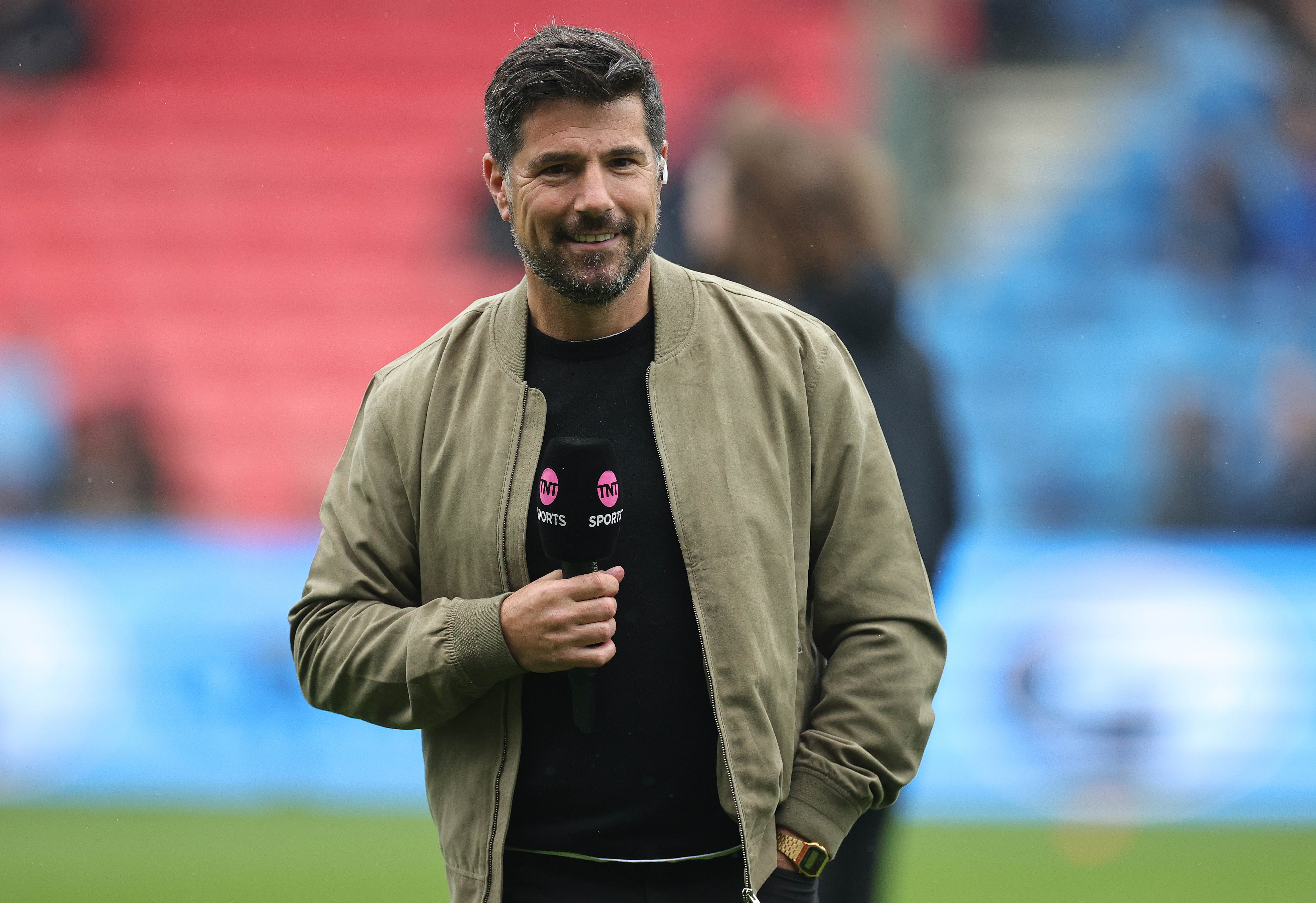 Craig Doyle holding a TNT Sports microphone
