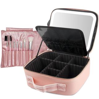 A pink makeup box features black compartments inside, and a lit LED mirror in the lid