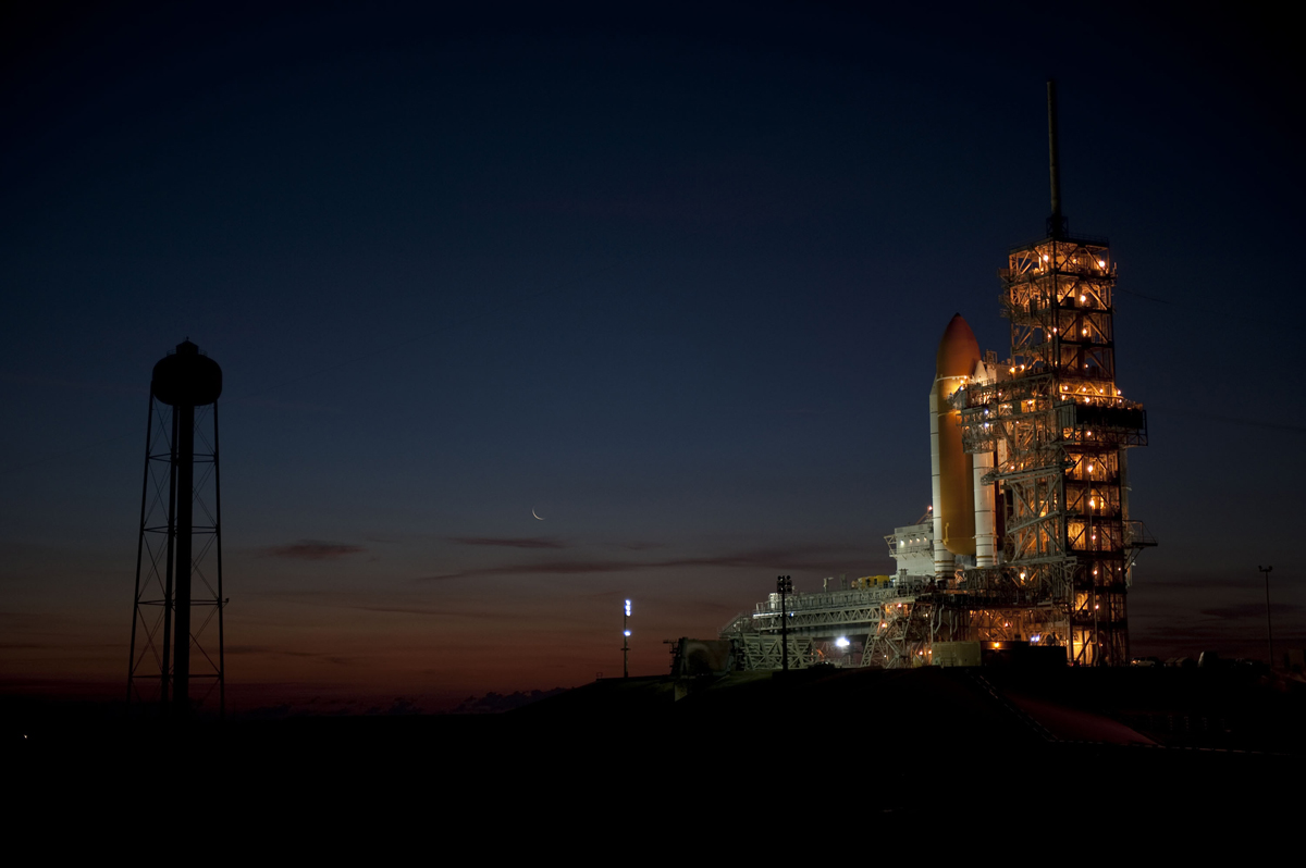 Space shuttle Discovery is photographed at sunrise at the launch pad before its final mission. 