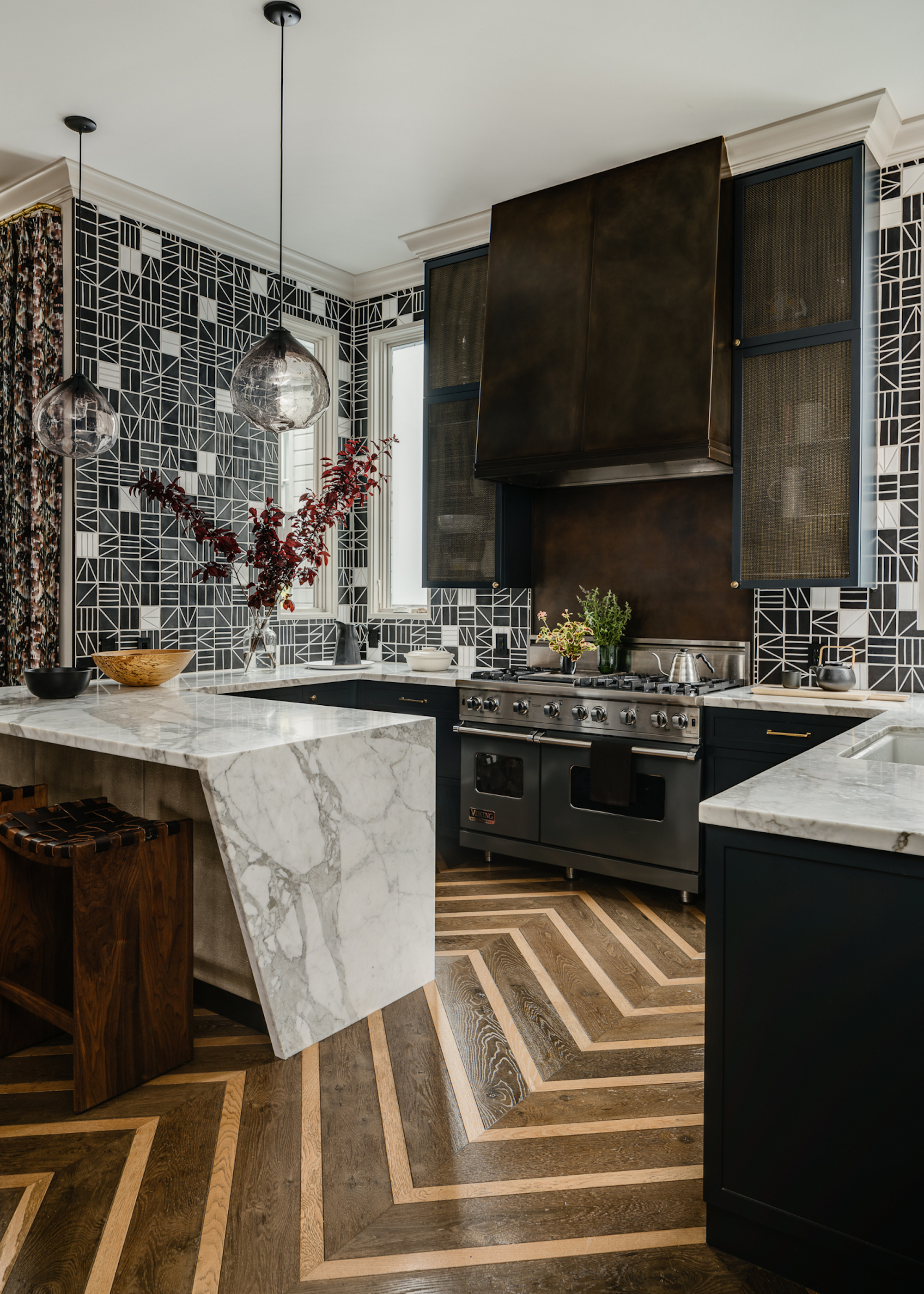 kitchen with zig zag floor and marble peninsula