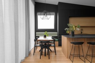 A kitchen with light wood flooring