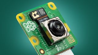 The Raspberry Pi Camera Module 3 on a green background