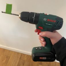 Masking tape wrapped around a drill bit to show a specific drill depth