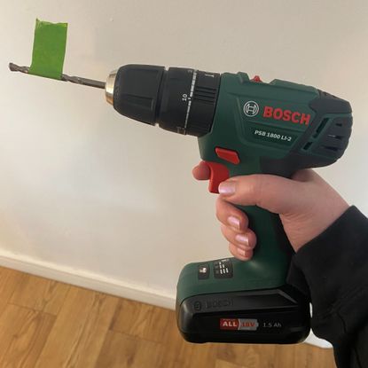 Masking tape wrapped around a drill bit to show a specific drill depth